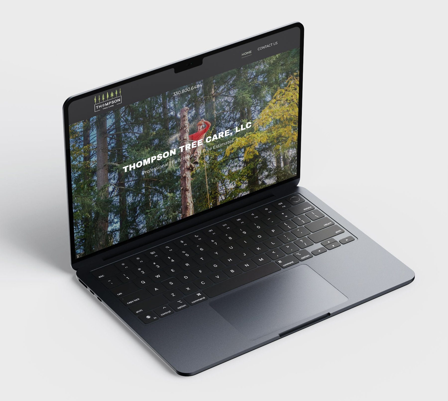 Thompson Tree Care website on a laptop, with a climber in a red shirt cutting a tall pine